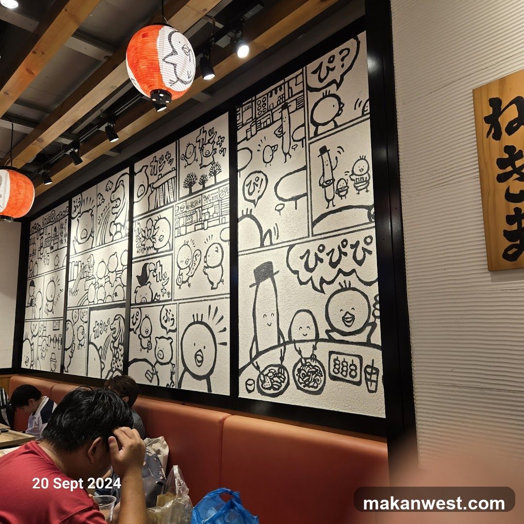 Interior of a Japanese-style restaurant with manga-themed wall art