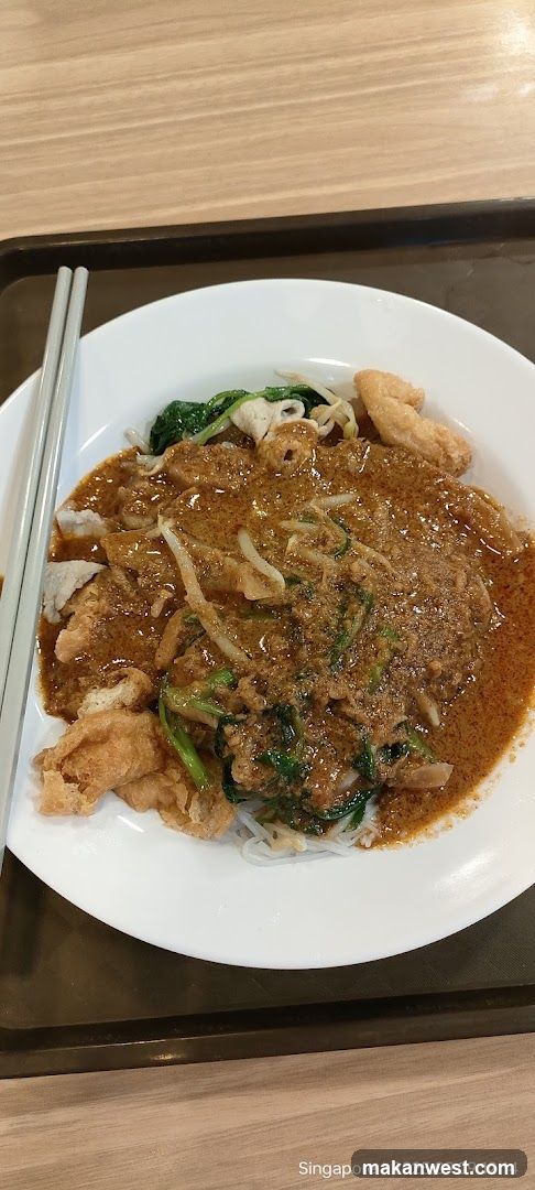 Curry Noodle Dish with Fried Dough and Greens
