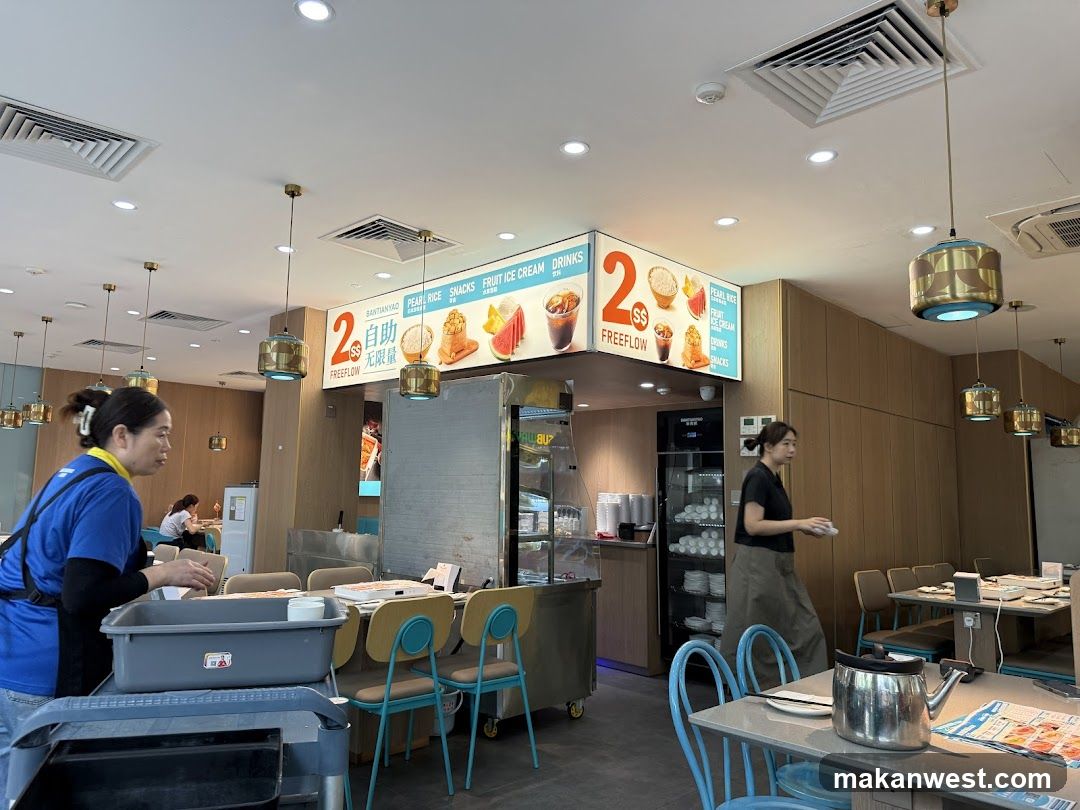 Restaurant Interior with Staff and Signage
