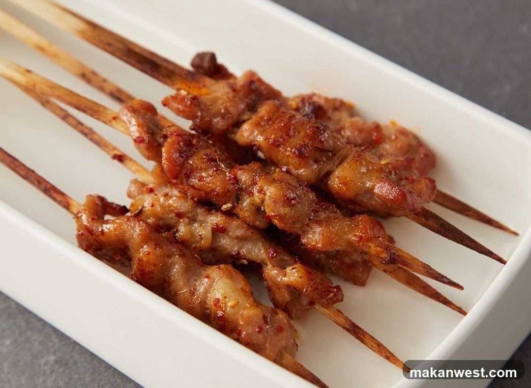Grilled Meat Skewers on White Plate