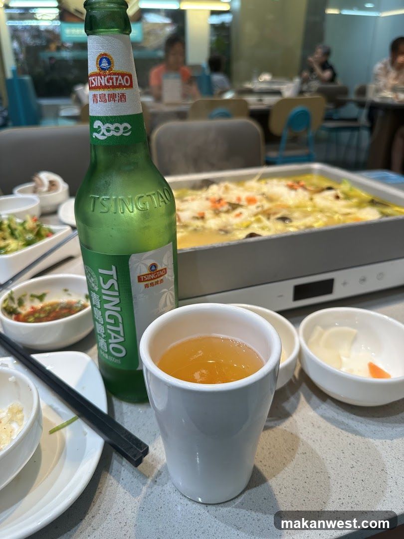 Dining Table with Tsingtao Beer and Hot Pot