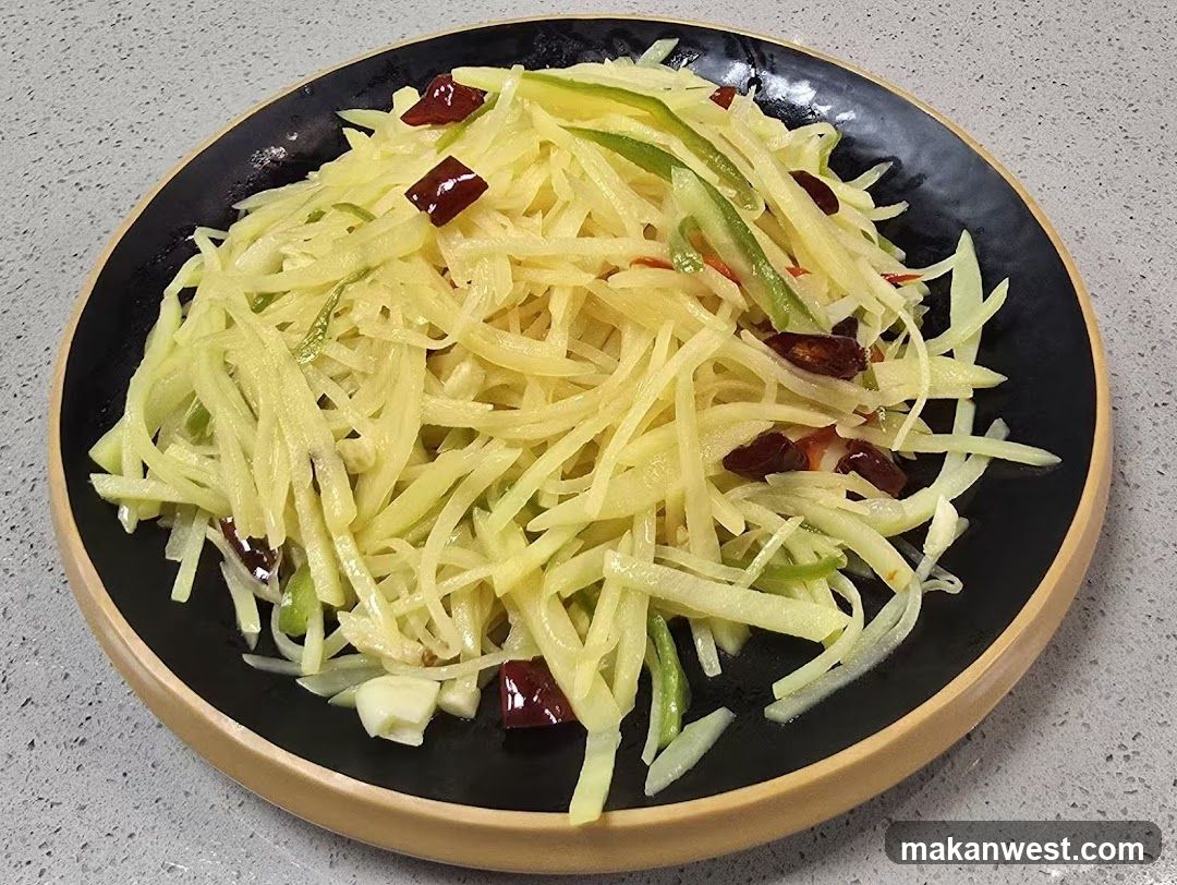 Sliced Potato Dish with Chili Peppers