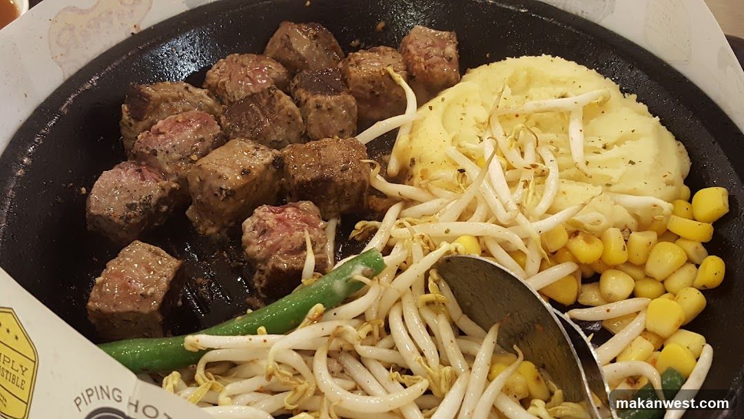 Sizzling Steak Platter with Mashed Potatoes and Corn