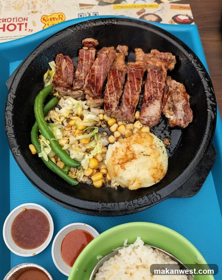 Sizzling Steak Plate with Rice and Sides