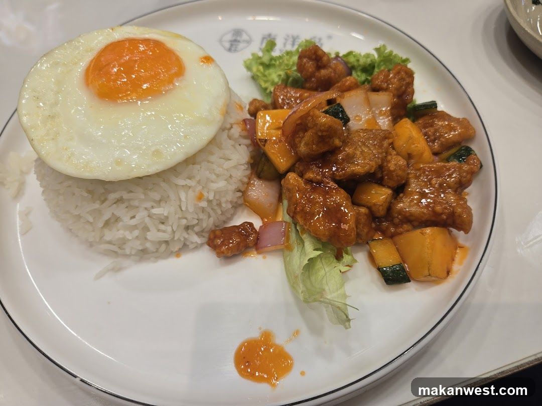Fried Egg and Sweet and Sour Chicken Rice Plate