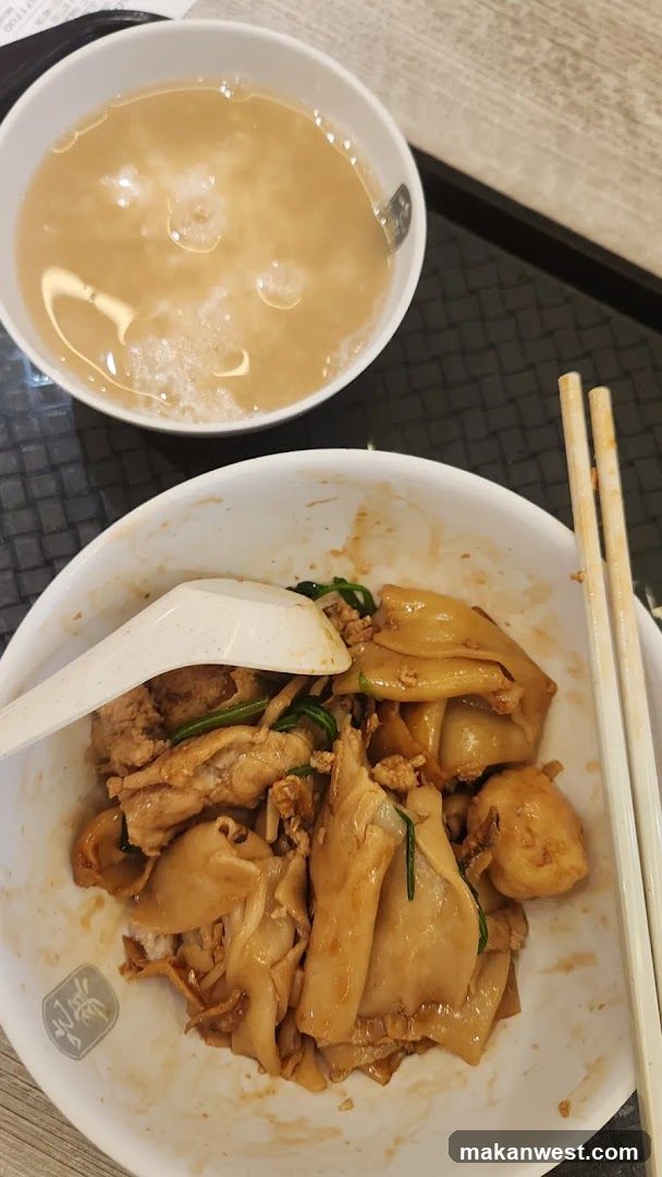Bowl of stir-fried noodles with soup