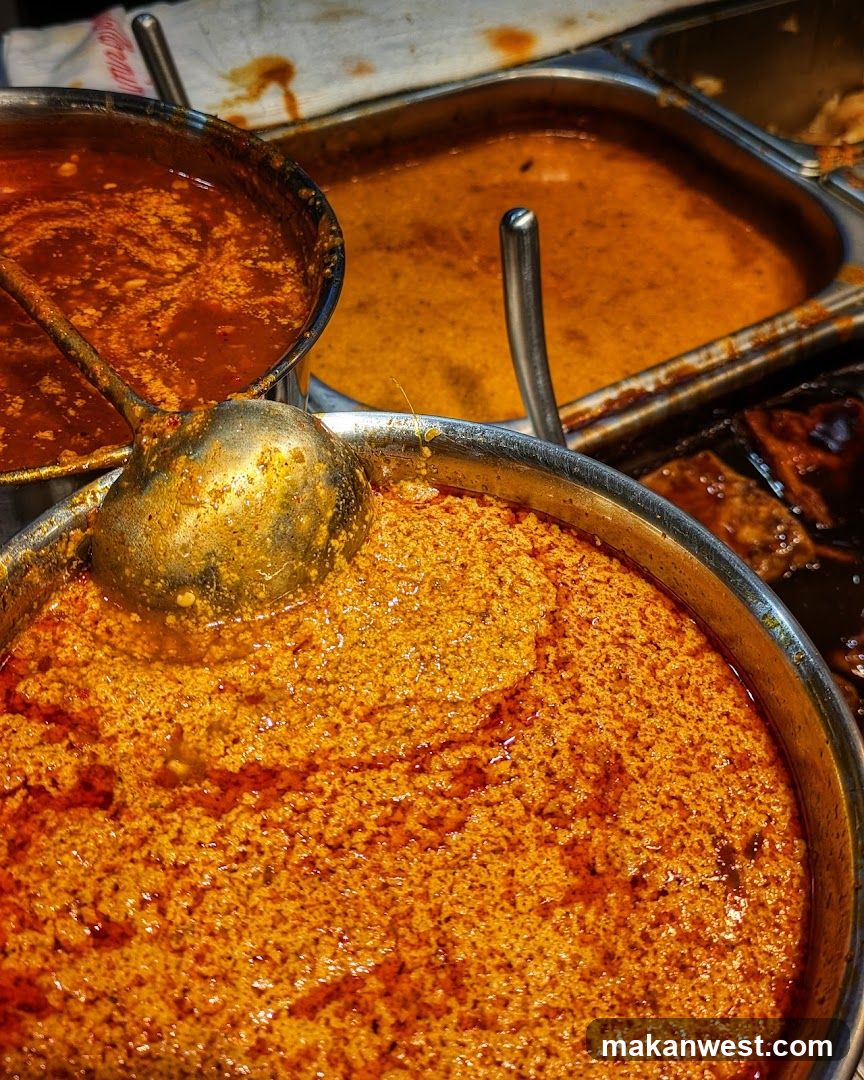 Spicy Curry Dishes in Metal Pots