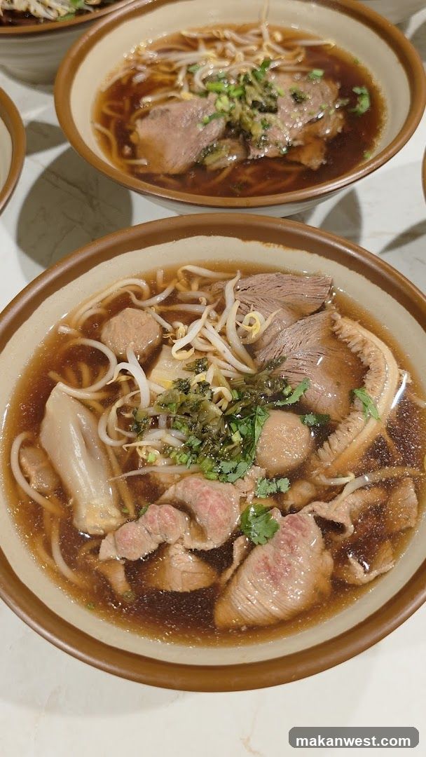 Bowl of Noodle Soup with Meat and Vegetables