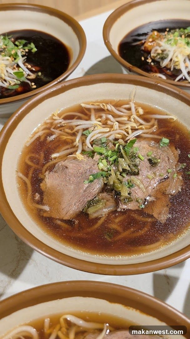 Bowl of Noodle Soup with Meat and Bean Sprouts