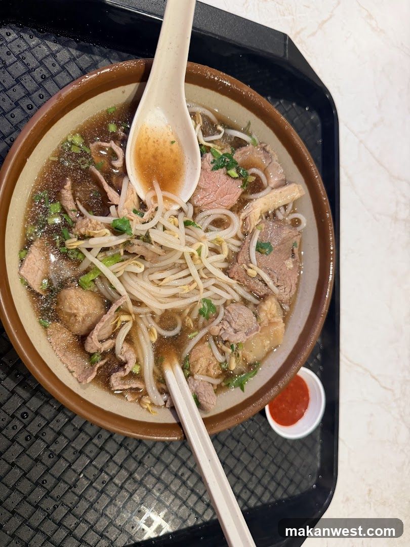 Bowl of Pho with Chopsticks and Spoon