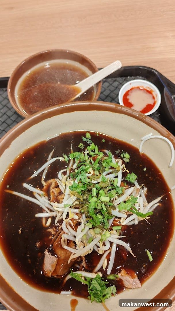 Bowl of Dark Broth with Toppings
