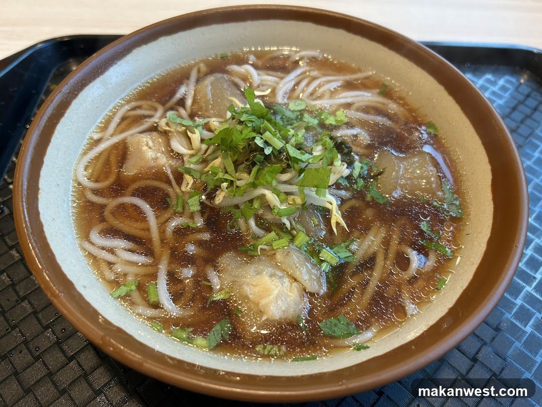 Bowl of Noodle Soup with Toppings