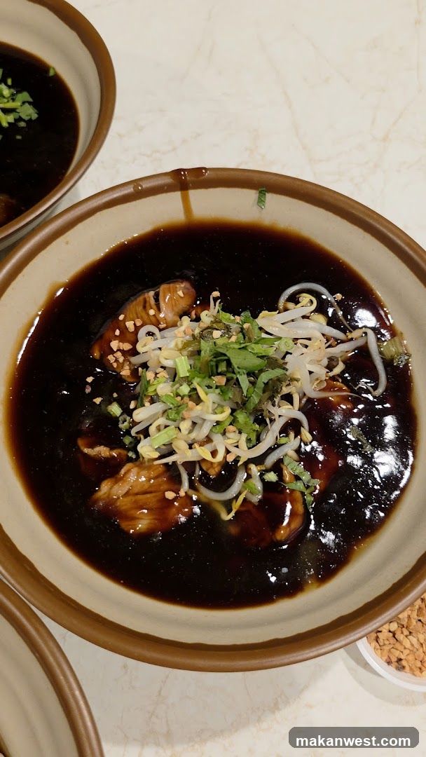 Bowl of Dark Soy Sauce Dish with Toppings