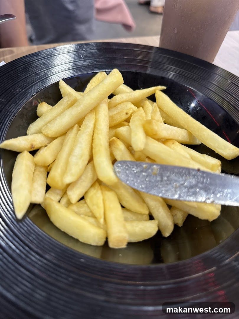 French Fries on a Black Plate