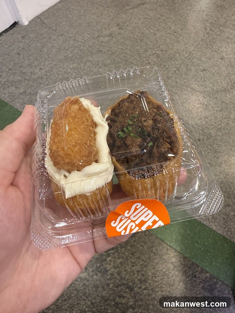 Handheld food container with two pastries