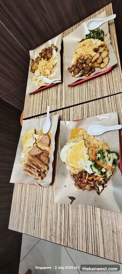 Four plates of rice dishes on a table