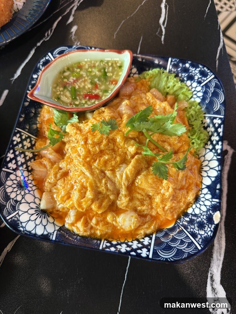 Thai-style egg curry dish with dipping sauce