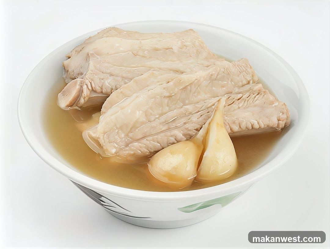 Bowl of Broth with Meat and Garlic