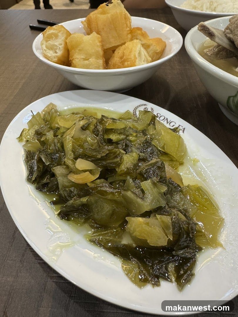 Dish with pickled vegetables and fried dough sticks