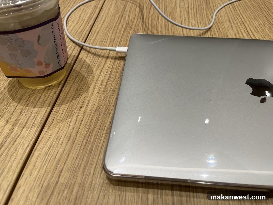 Laptop and Drink on Wooden Table