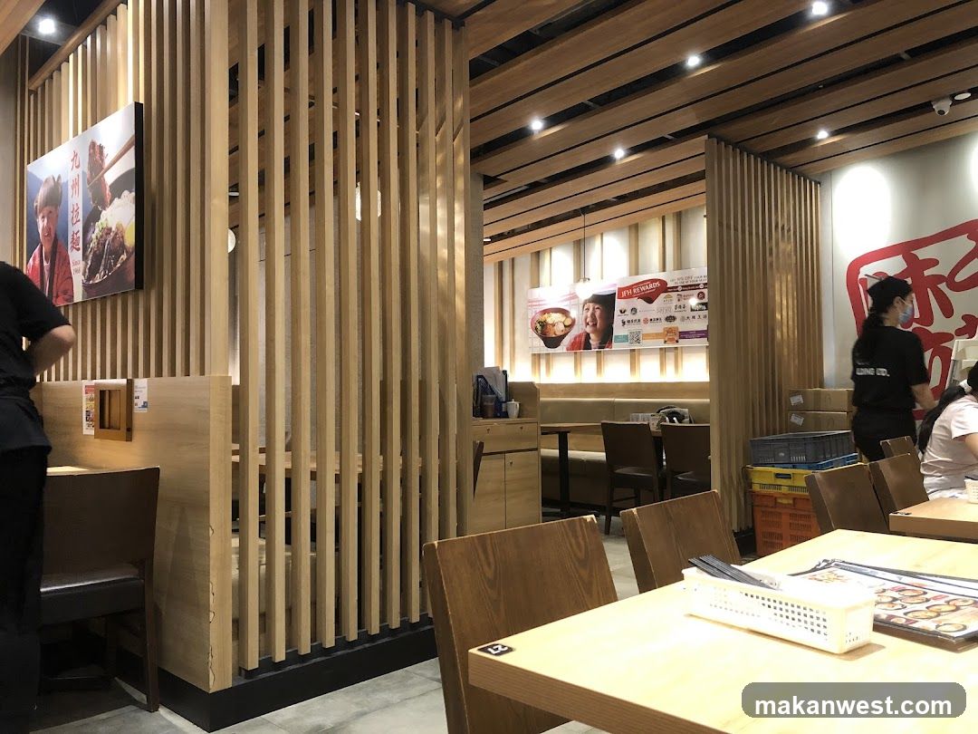 Restaurant Interior with Wooden Slats and Staff