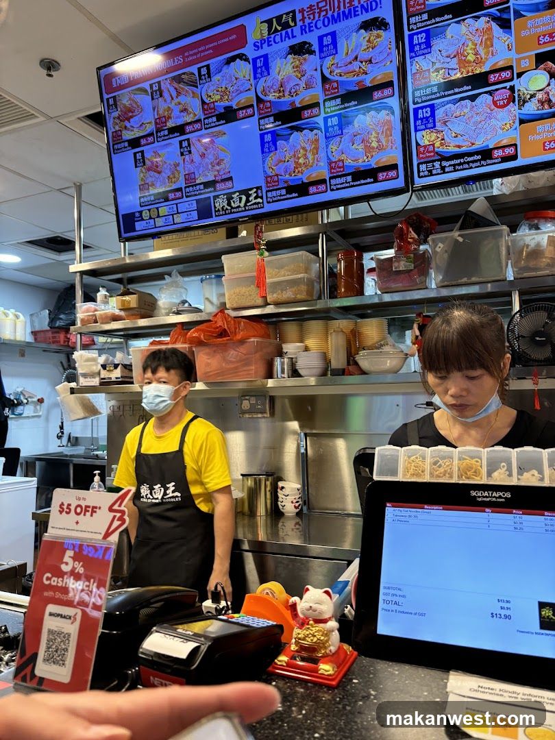 Restaurant Interior with Staff and Menu Screens
