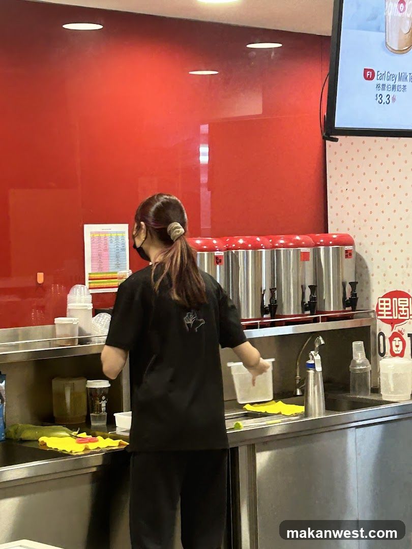 Staff preparing drinks at counter