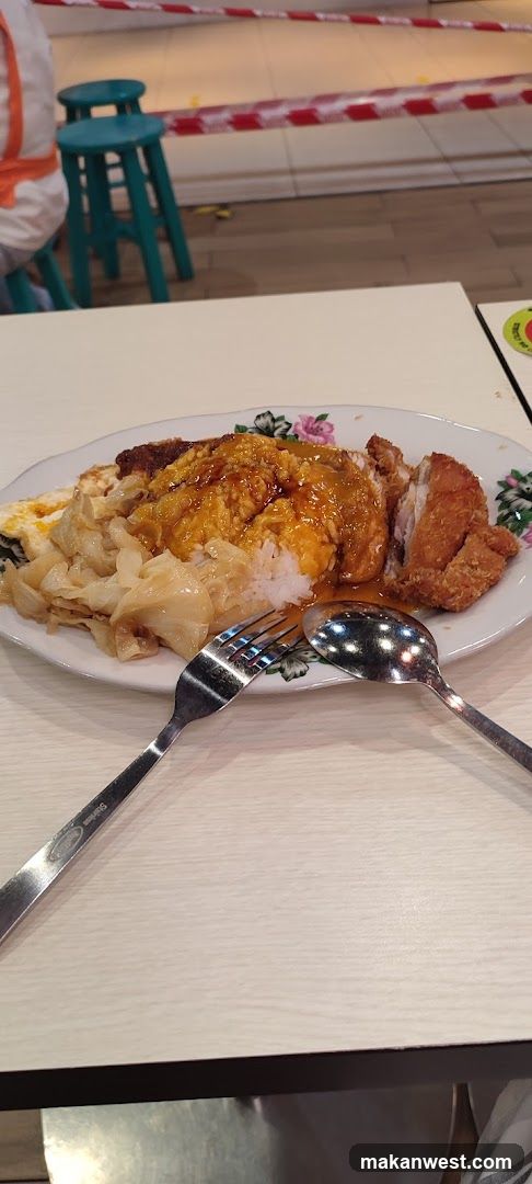 Plate of Chicken Rice with Fried Egg and Cabbage