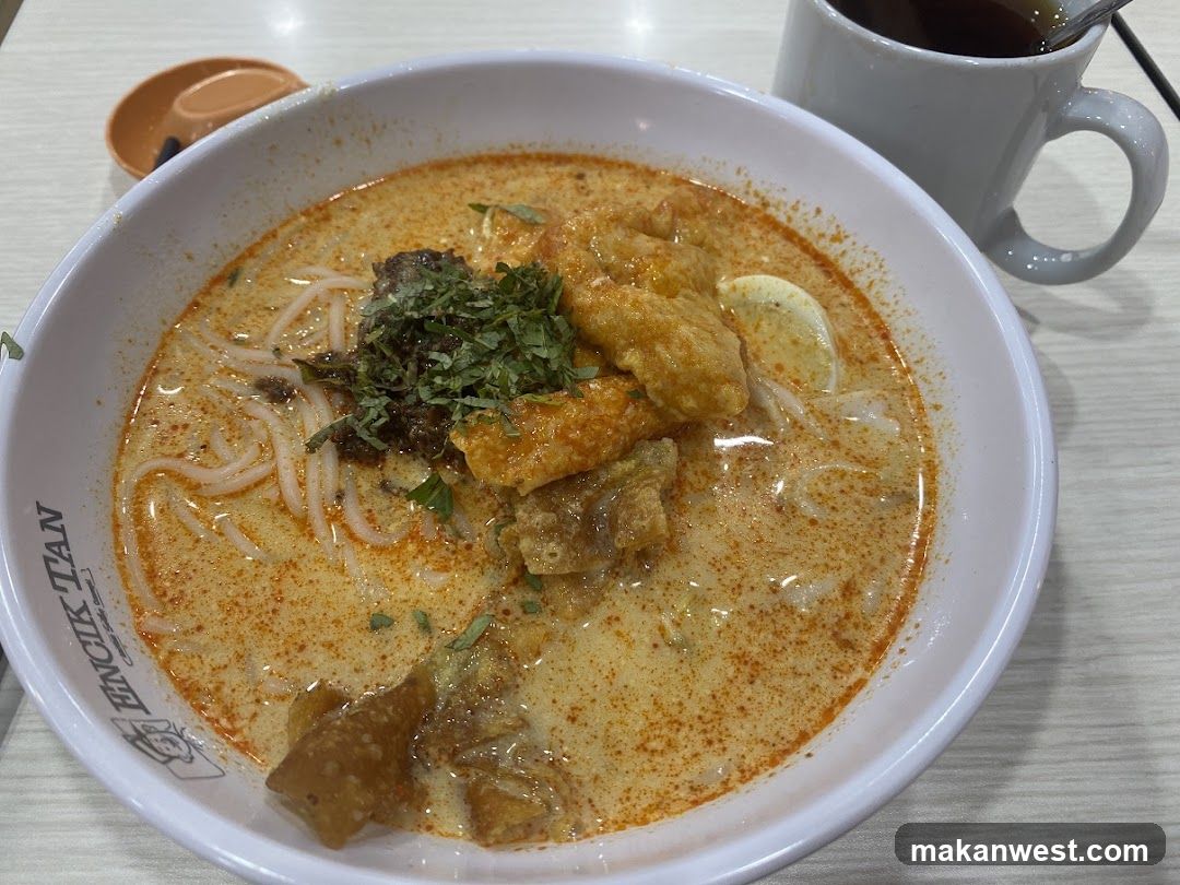 Bowl of Curry Noodles with Side Coffee