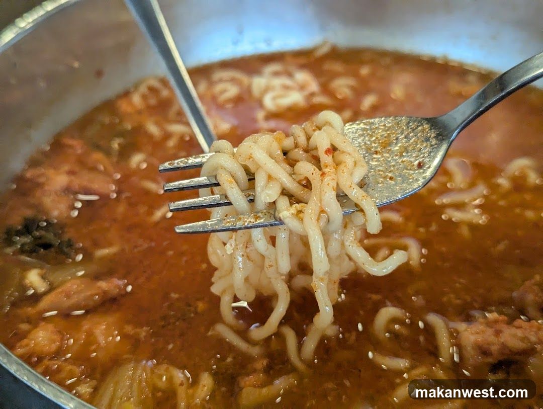 Forkful of Noodles in Broth