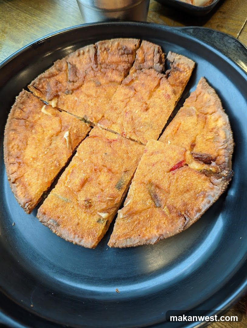 Fried Flatbread on Black Plate