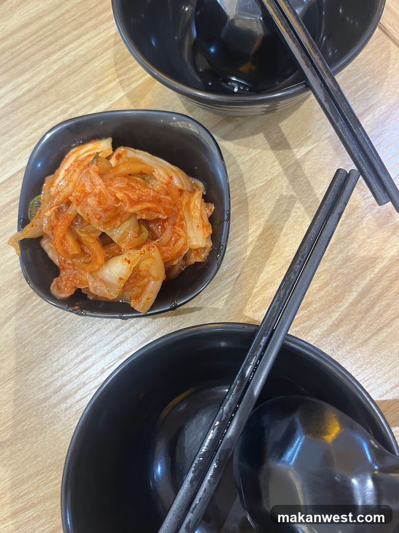 Korean side dish with kimchi and bowls