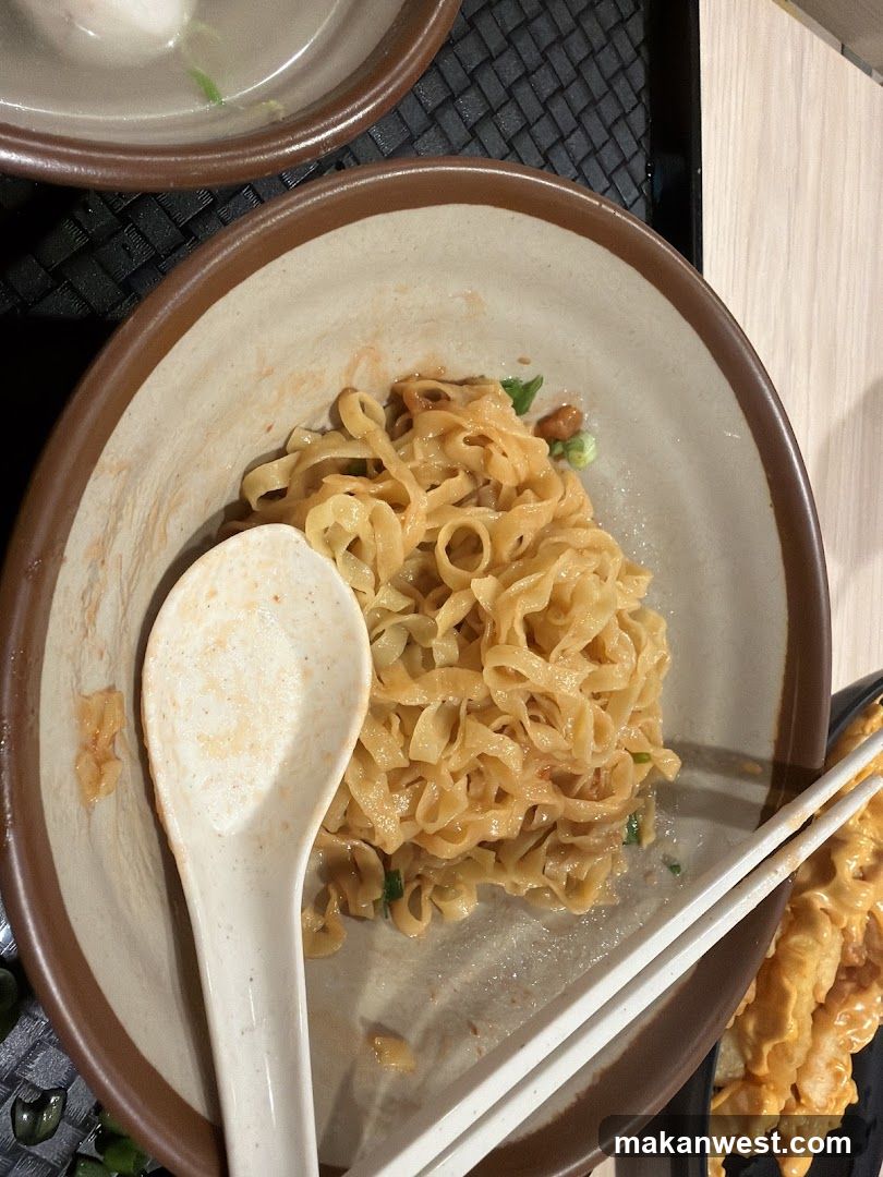 Noodle Bowl with Chopsticks and Spoon