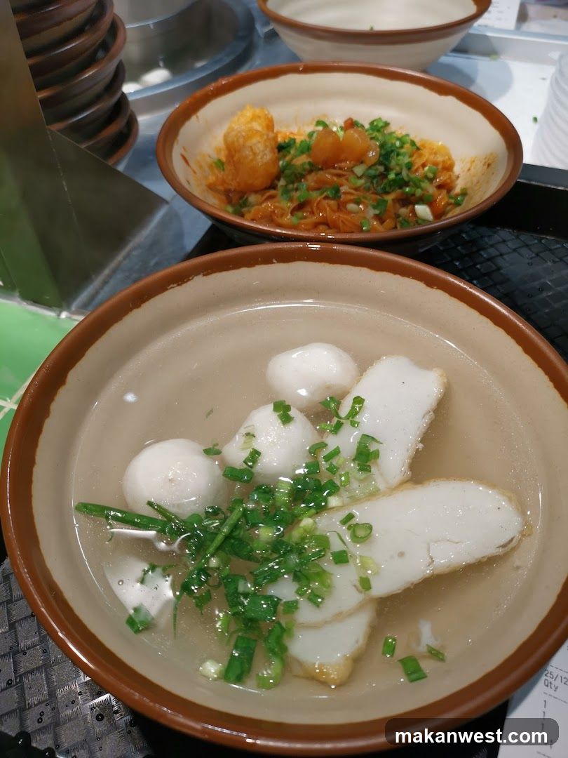 Bowl of Fish Balls and Noodles with Green Onions