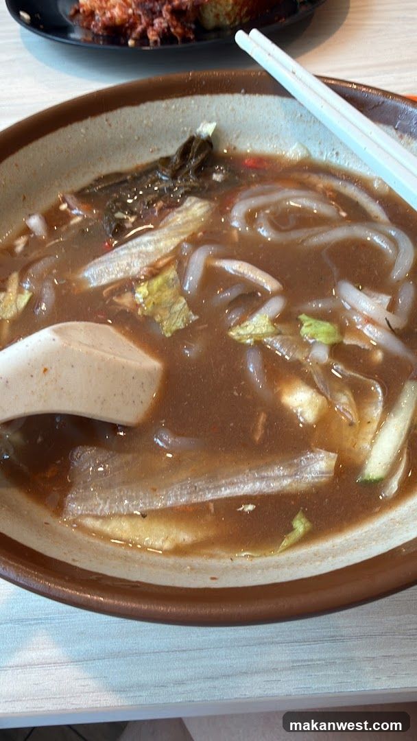 Bowl of Noodle Soup with Chopsticks