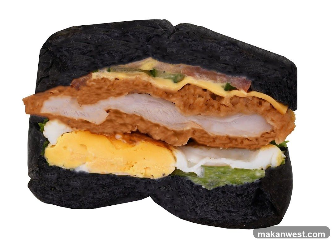 Black Bread Sandwich with Fried Chicken and Egg