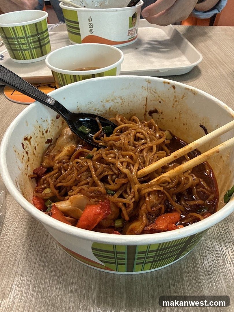 Noodle Bowl with Chopsticks and Spoon