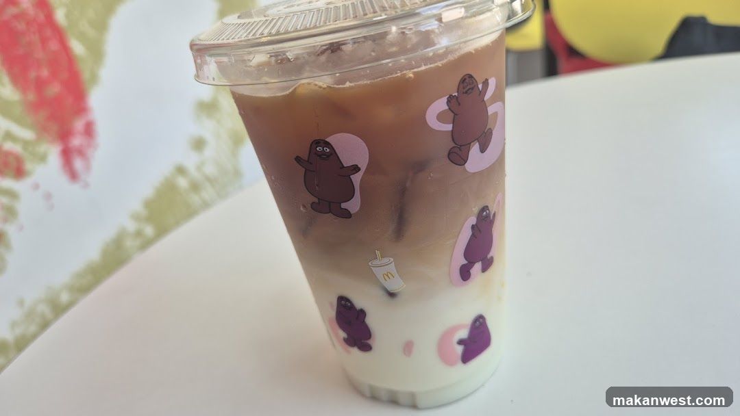 Iced beverage with cartoon stickers