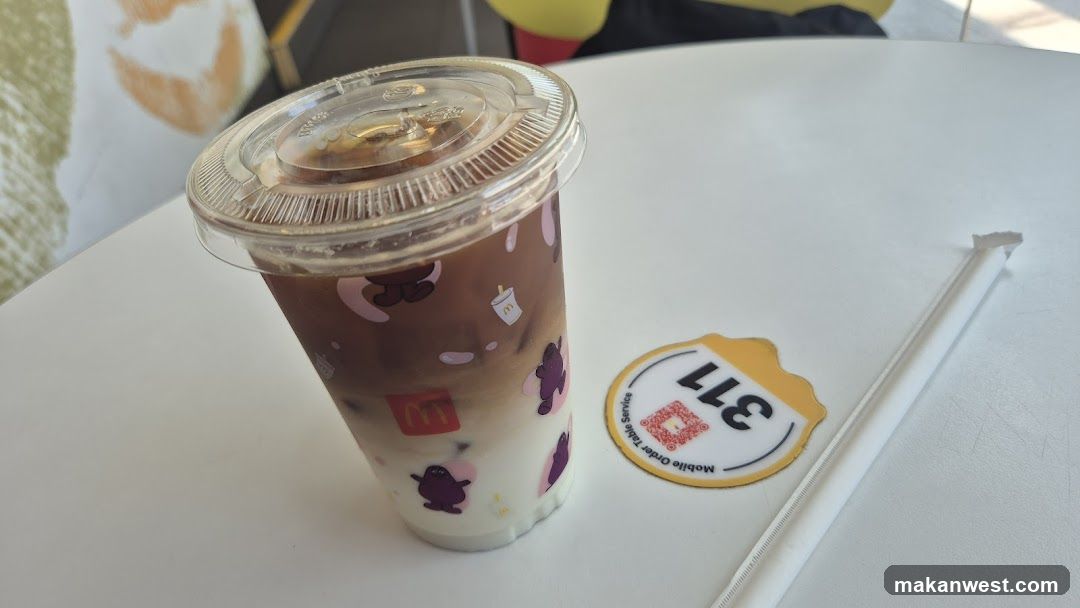 Iced beverage with branded cup and QR sticker