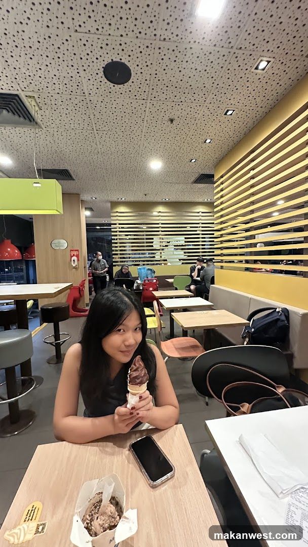Person eating ice cream in a cafe