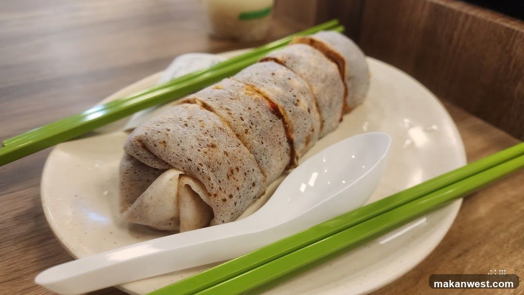 Steamed Bun with Green Chopsticks and Spoon