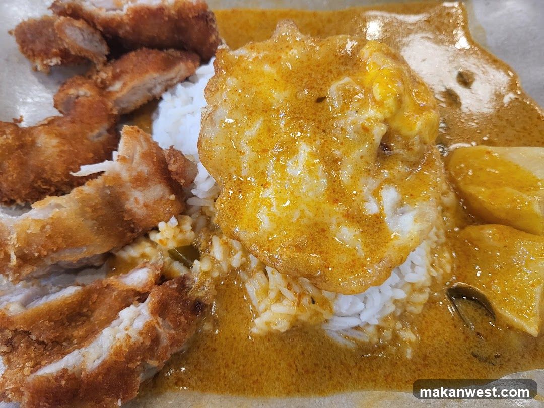 Curry Rice with Fried Egg and Pork Cutlet