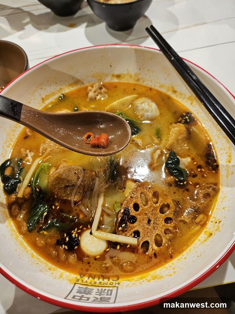 Spicy Noodle Bowl with Lotus Root and Meatballs