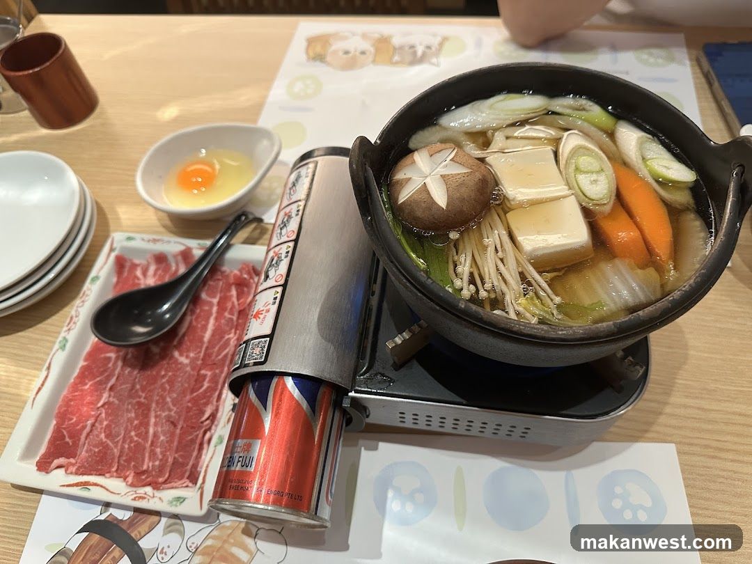 Hot Pot Meal with Raw Beef and Egg