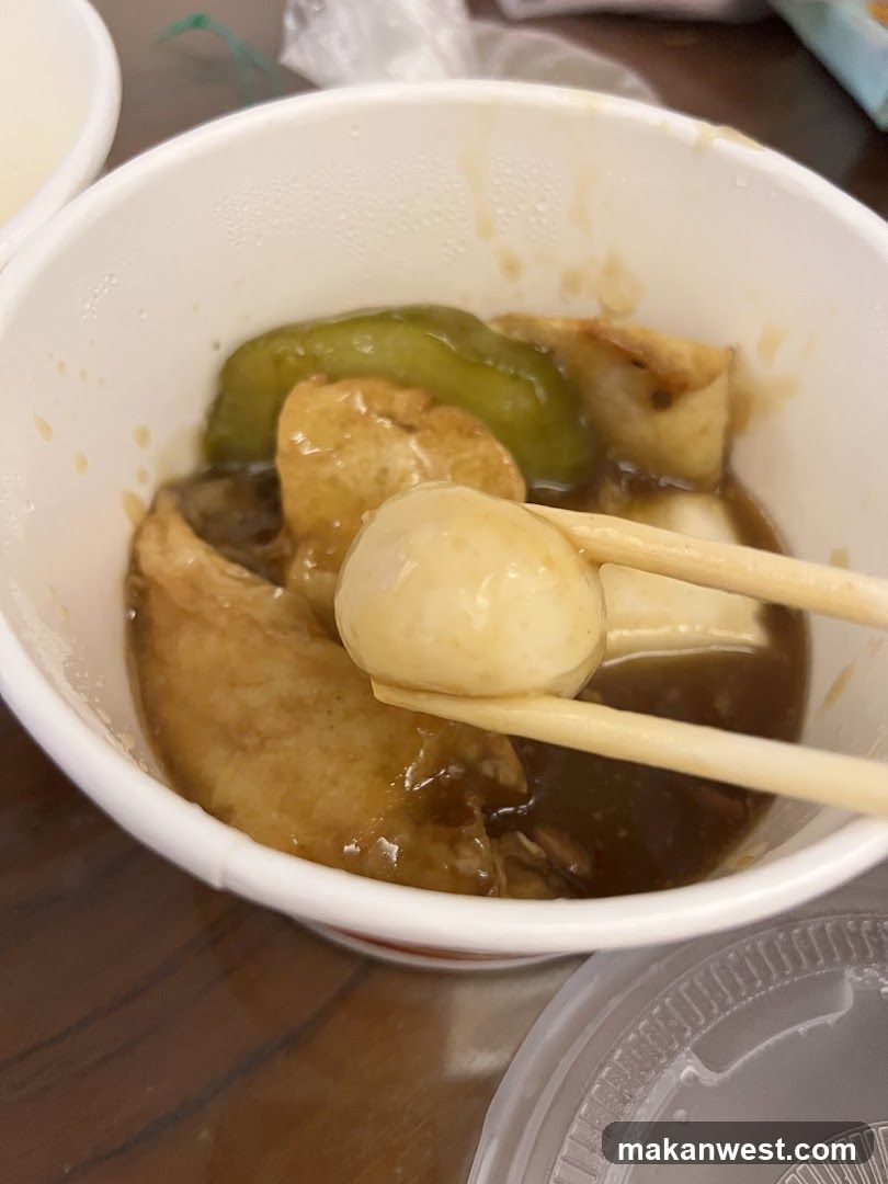 Bowl of Soup with Tofu and Pickles