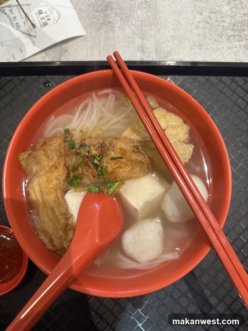 Bowl of Noodle Soup with Fish Balls and Tofu