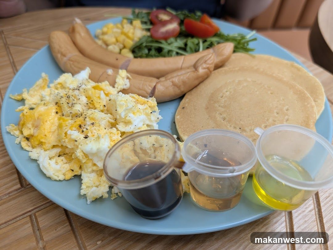 Breakfast Plate with Sausages, Eggs, Pancakes and Sauces