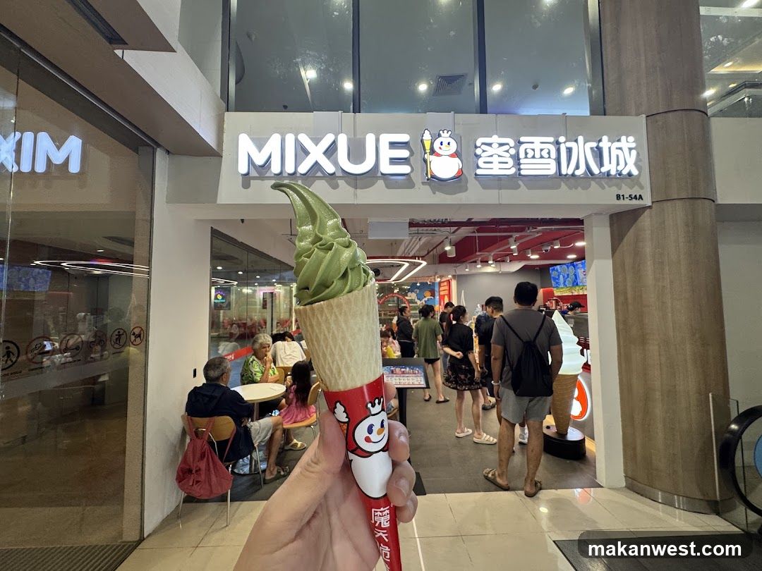 Ice cream cone in hand near MIXUE storefront