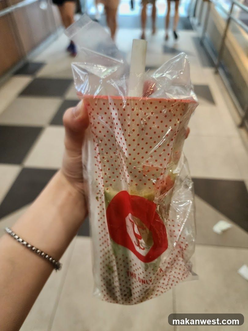 Handheld Drink in Polka-Dot Cup