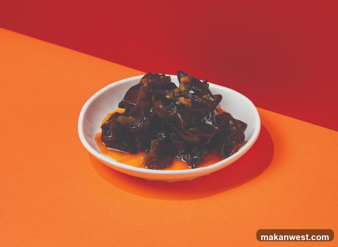Dish of dark food in white bowl